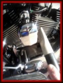 Blowing water off of chrome on a motorcycle by Fifty Dollar Detail.