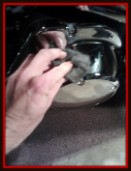 Steel wool being used to polish motorcycle chrome by Fifty Dollar Detail.